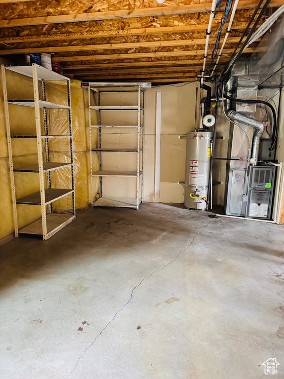 Below grade area with gas water heater and heating unit
