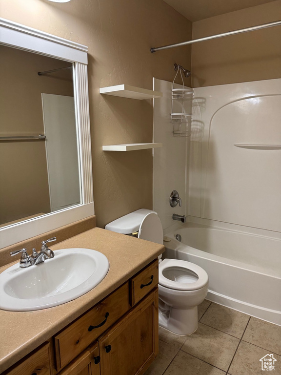 Full bathroom featuring vanity, tile patterned flooring, and shower / bath combination