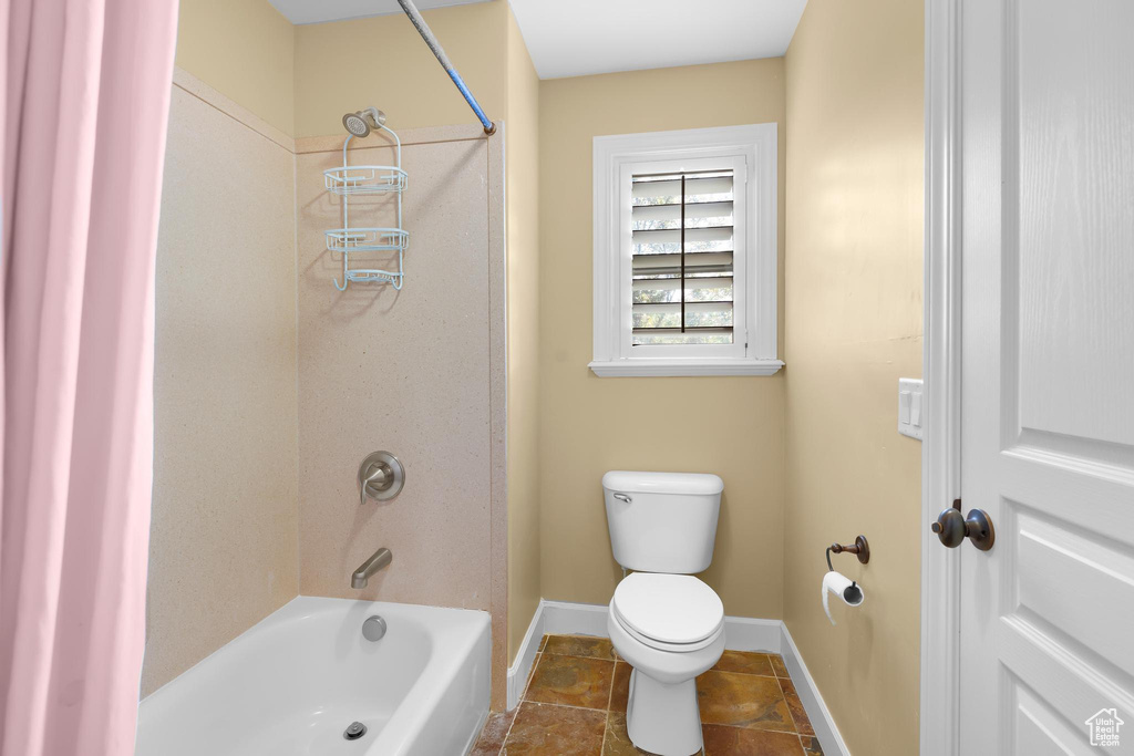 Full bath with toilet and shower / washtub combination