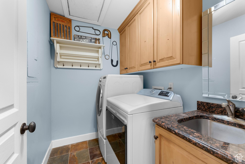 Laundry room with independent washer and dryer and cabinet space