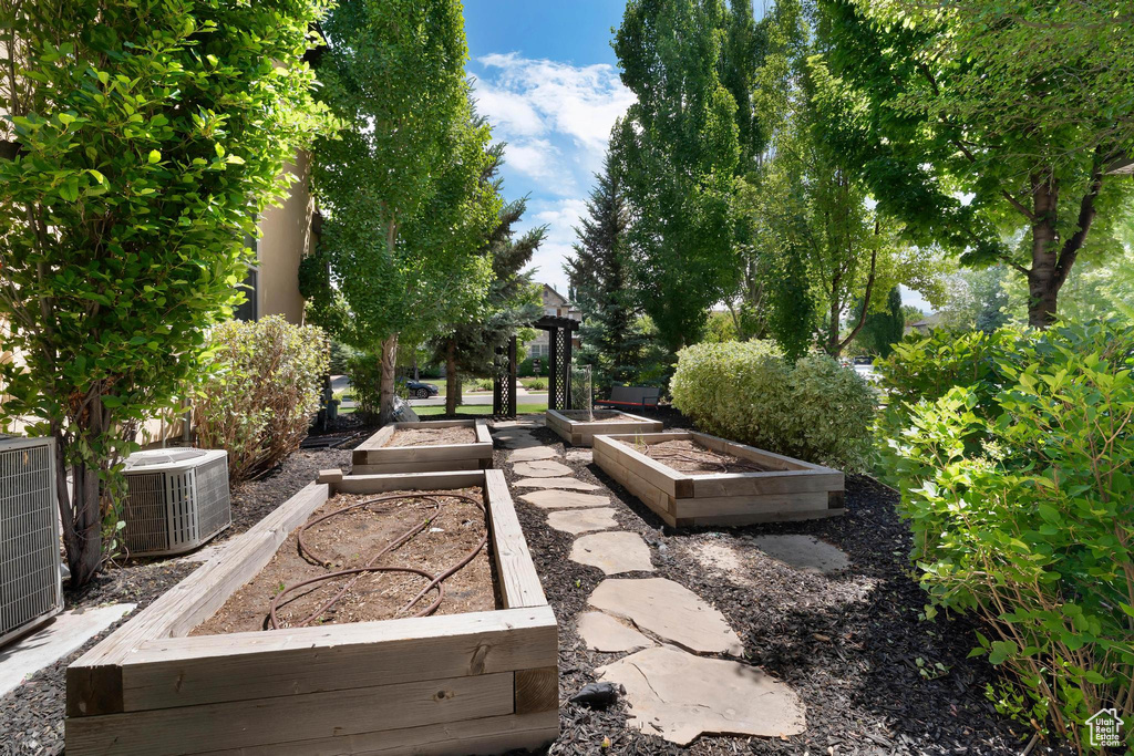 View of patio featuring a vegetable garden
