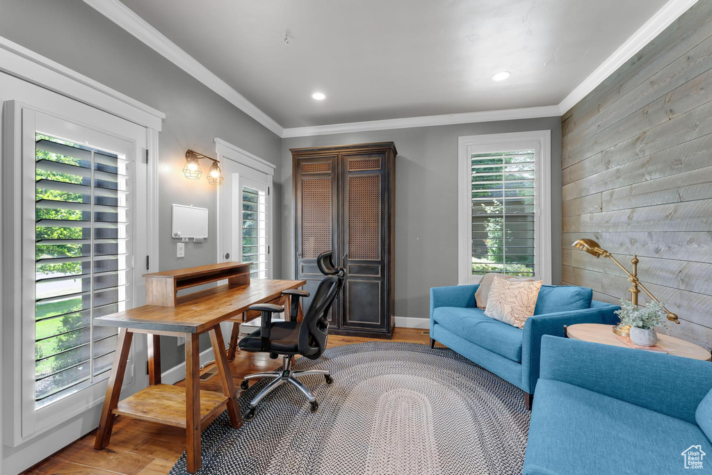 Home office with wood walls, ornamental molding, recessed lighting, and wood finished floors