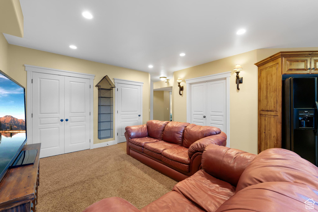 Living room with carpet flooring and recessed lighting