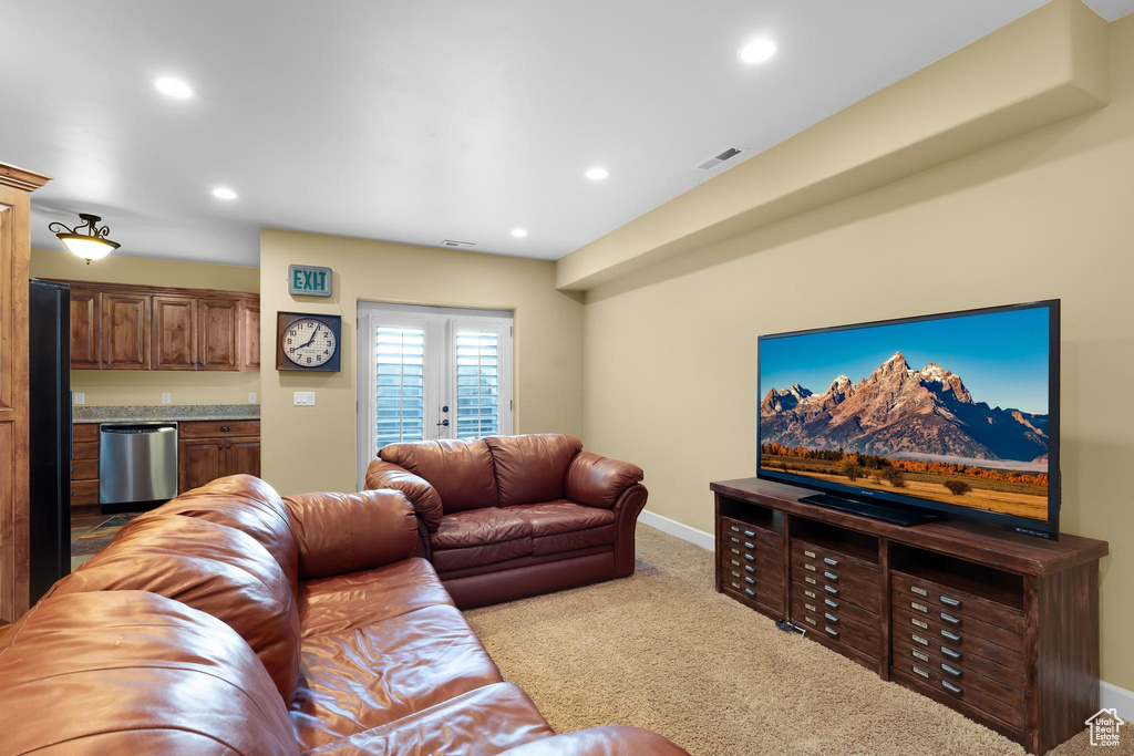 Living room with carpet flooring and recessed lighting
