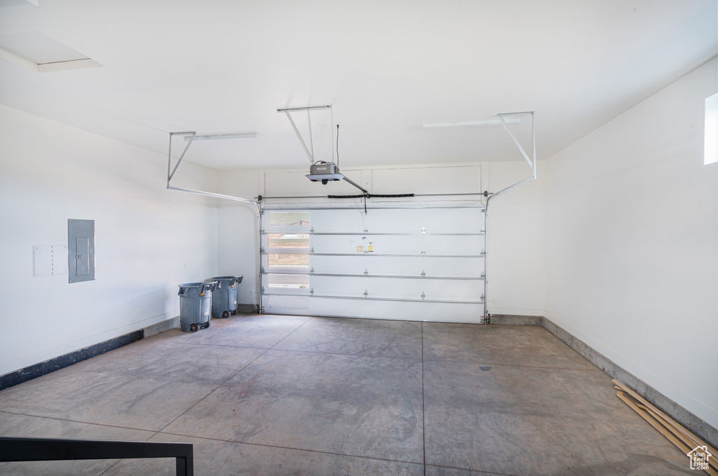 Garage with a garage door opener and electric panel