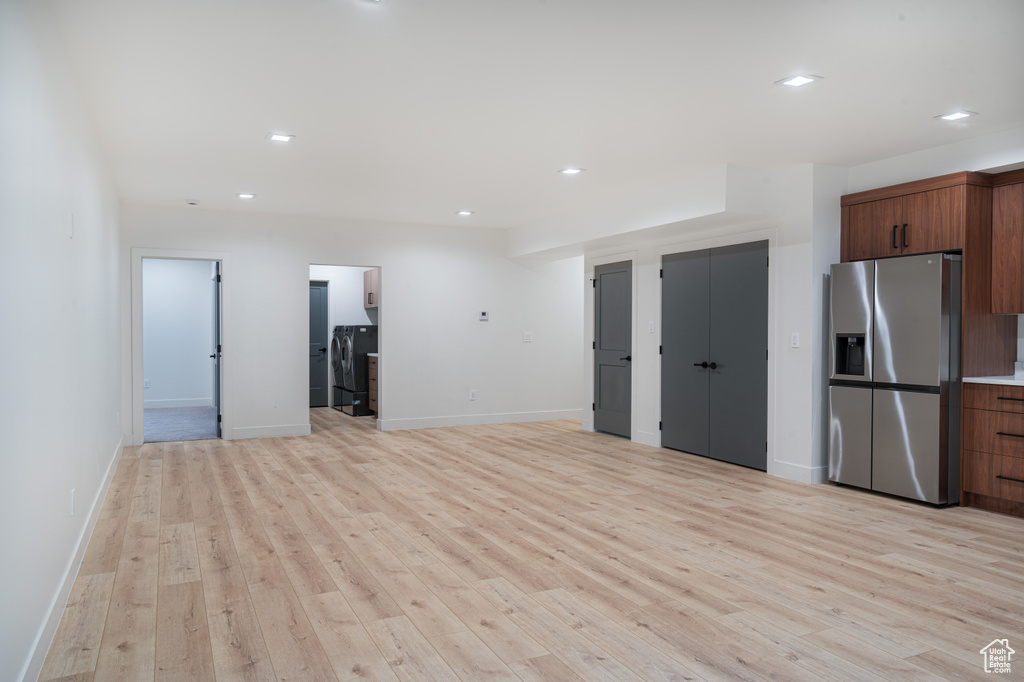 Unfurnished living room featuring light wood finished floors and recessed lighting