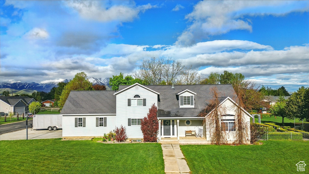 View of front of property with roof with shingles