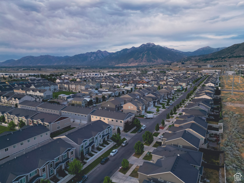 Aerial perspective of suburban area featuring a mountain backdrop