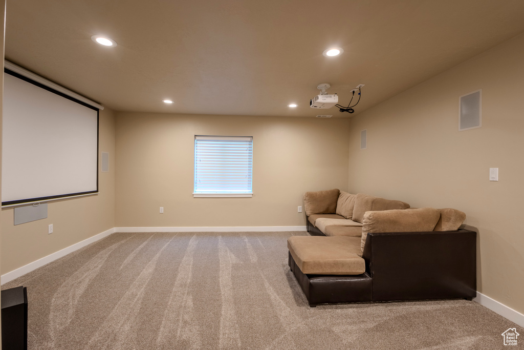 Cinema room with recessed lighting and carpet