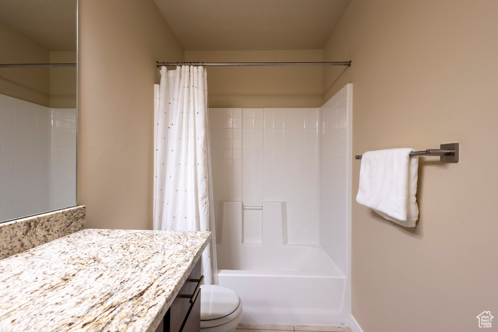 Full bathroom with vanity and shower / bath combination with curtain
