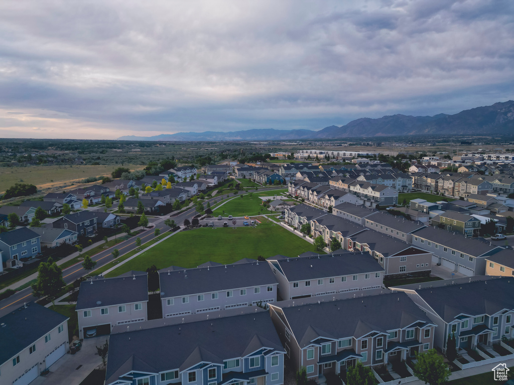 Aerial perspective of suburban area featuring a mountainous background