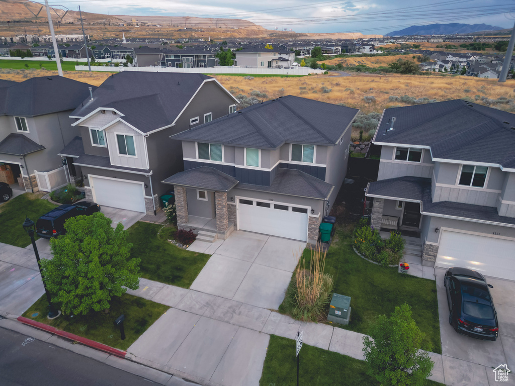 Aerial view of residential area with a mountainous background