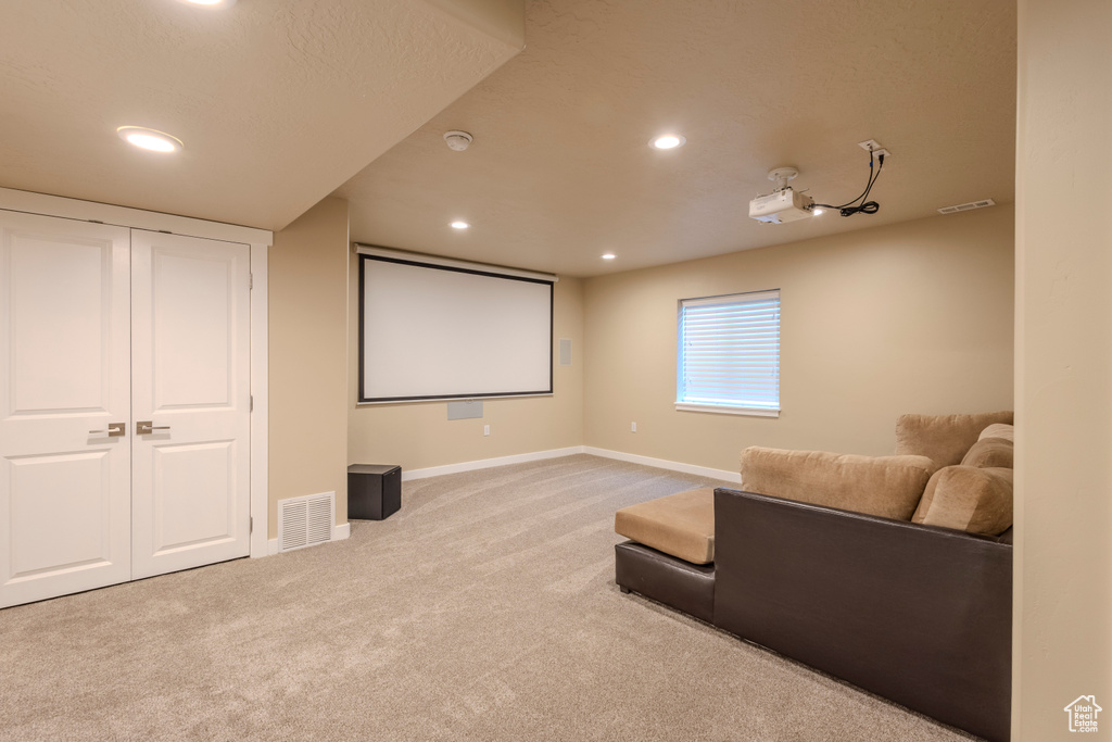 Home theater with carpet and recessed lighting