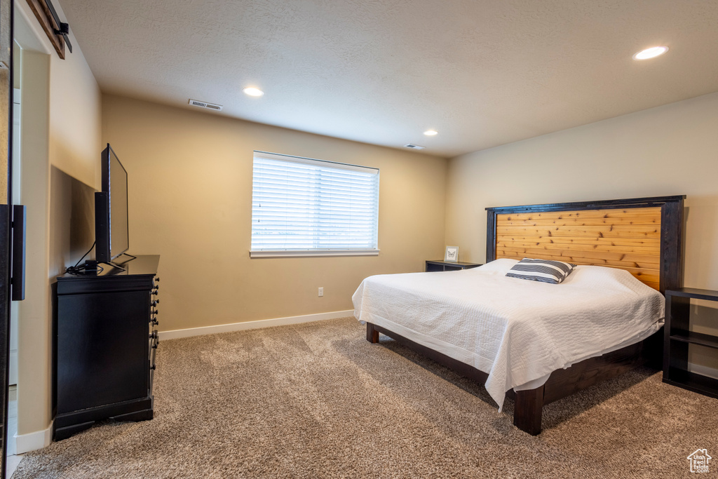 Bedroom featuring carpet floors and recessed lighting