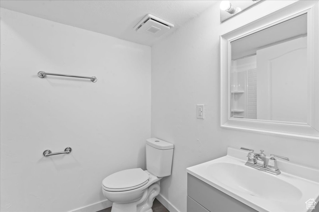 Bathroom with vanity and toilet