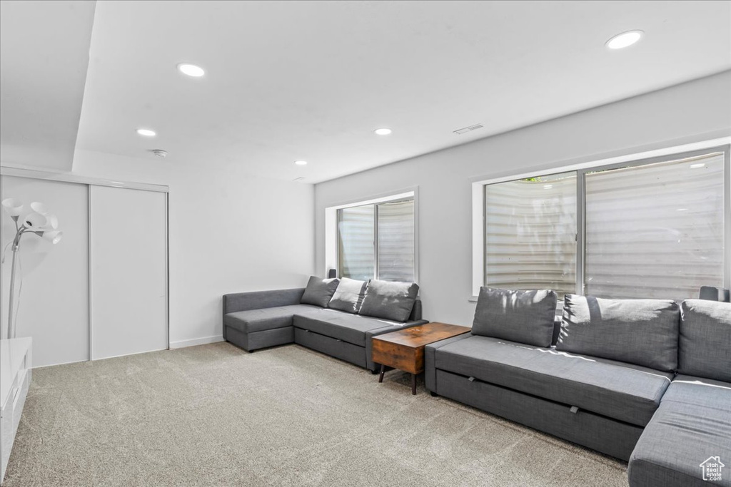 Living room featuring carpet flooring and recessed lighting