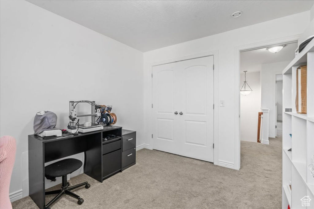 Office space featuring light colored carpet