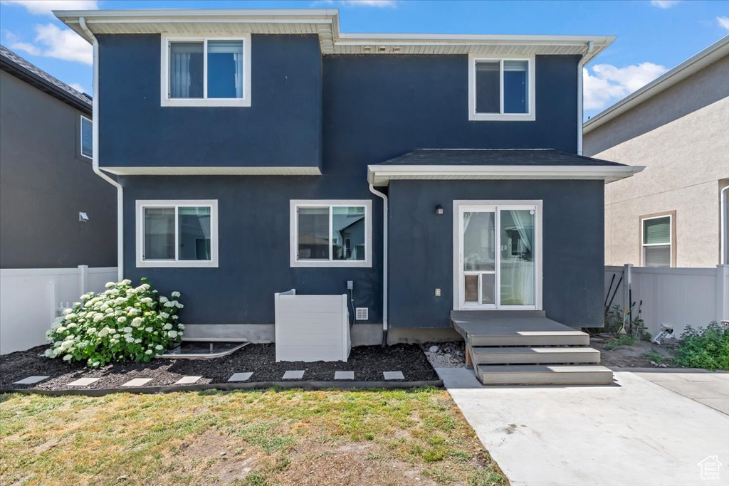 Back of property with stucco siding