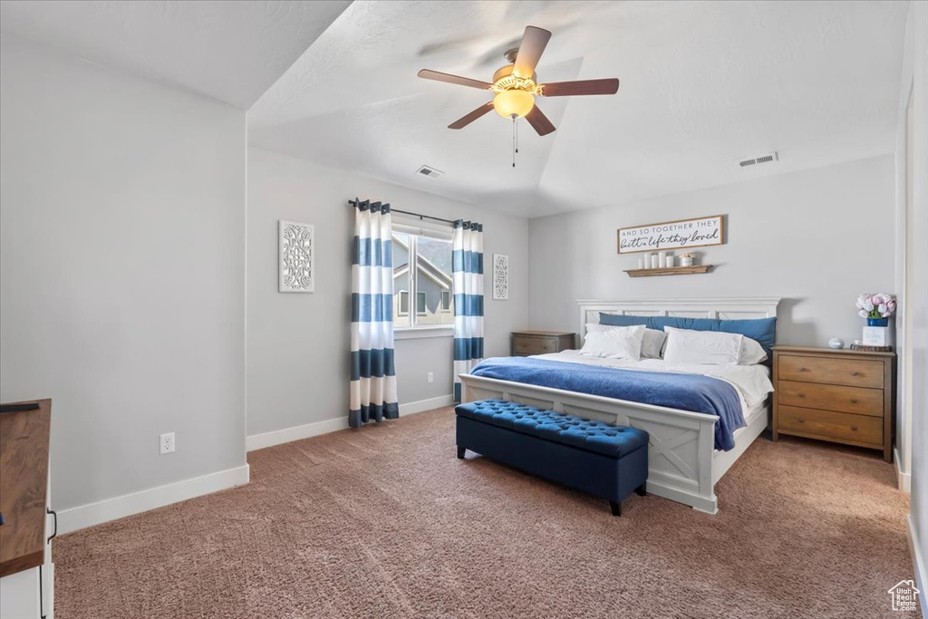 Bedroom with carpet floors and a ceiling fan