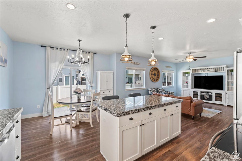Kitchen featuring a ceiling fan, dark wood-style flooring, white cabinets, a kitchen island, and recessed lighting