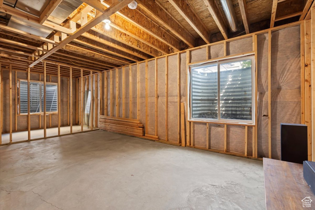 Miscellaneous room with unfinished concrete flooring