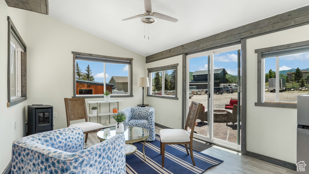 Sunroom / solarium featuring lofted ceiling and healthy amount of natural light