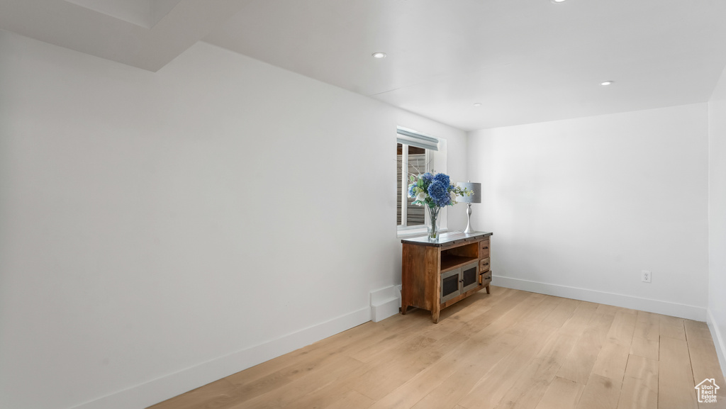 Unfurnished room with light wood-type flooring and recessed lighting