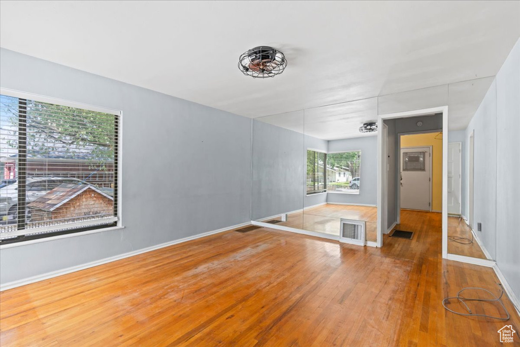 Spare room with wood finished floors and baseboards