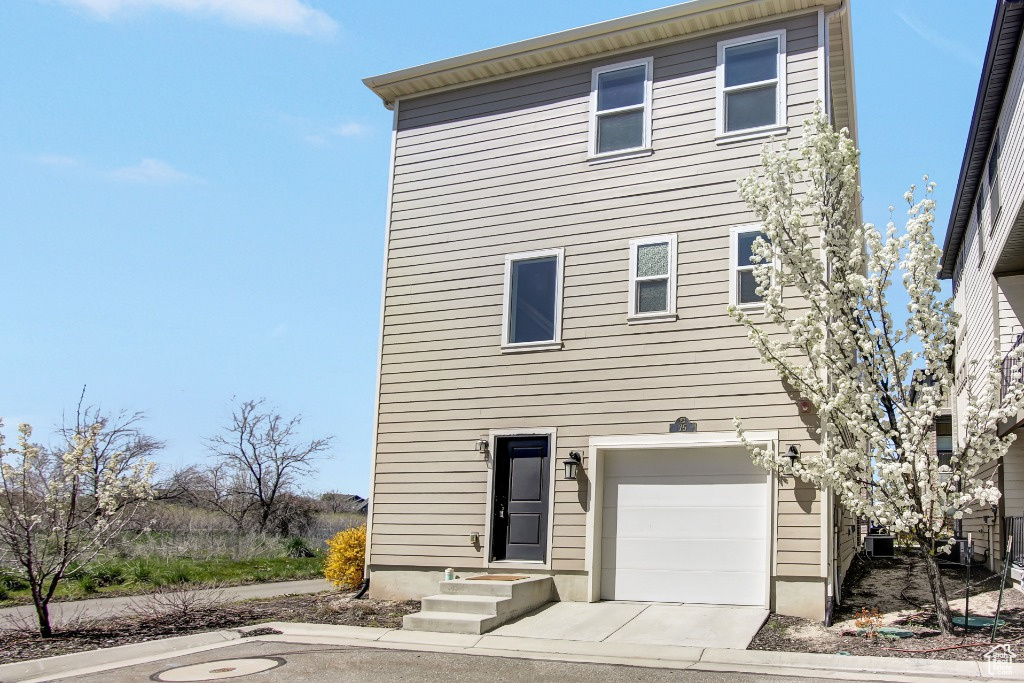 View of front of property with a garage
