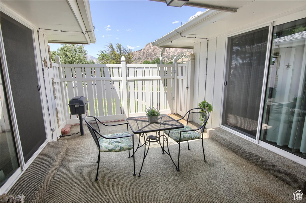 Balcony with a grill and outdoor dining space