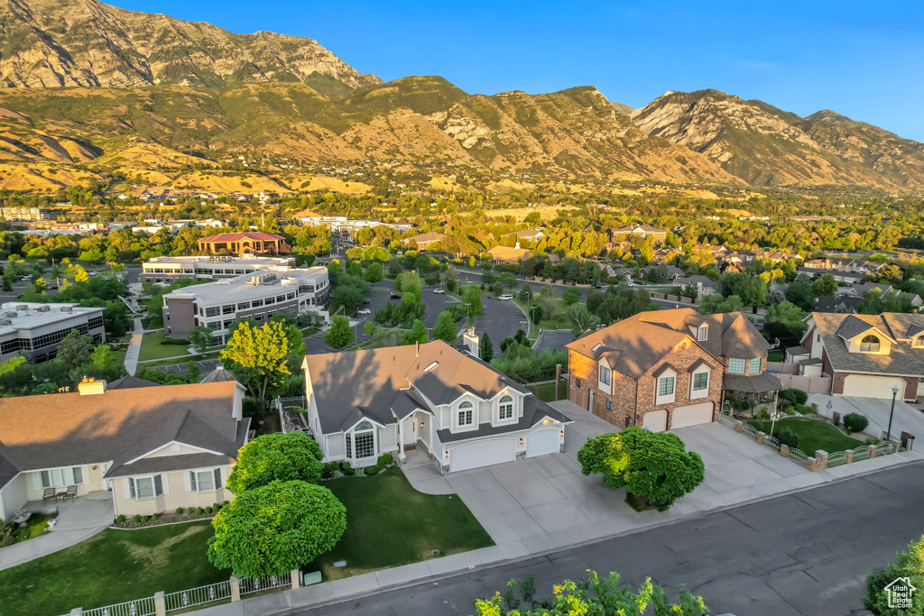 Aerial view of residential area featuring a mountainous background