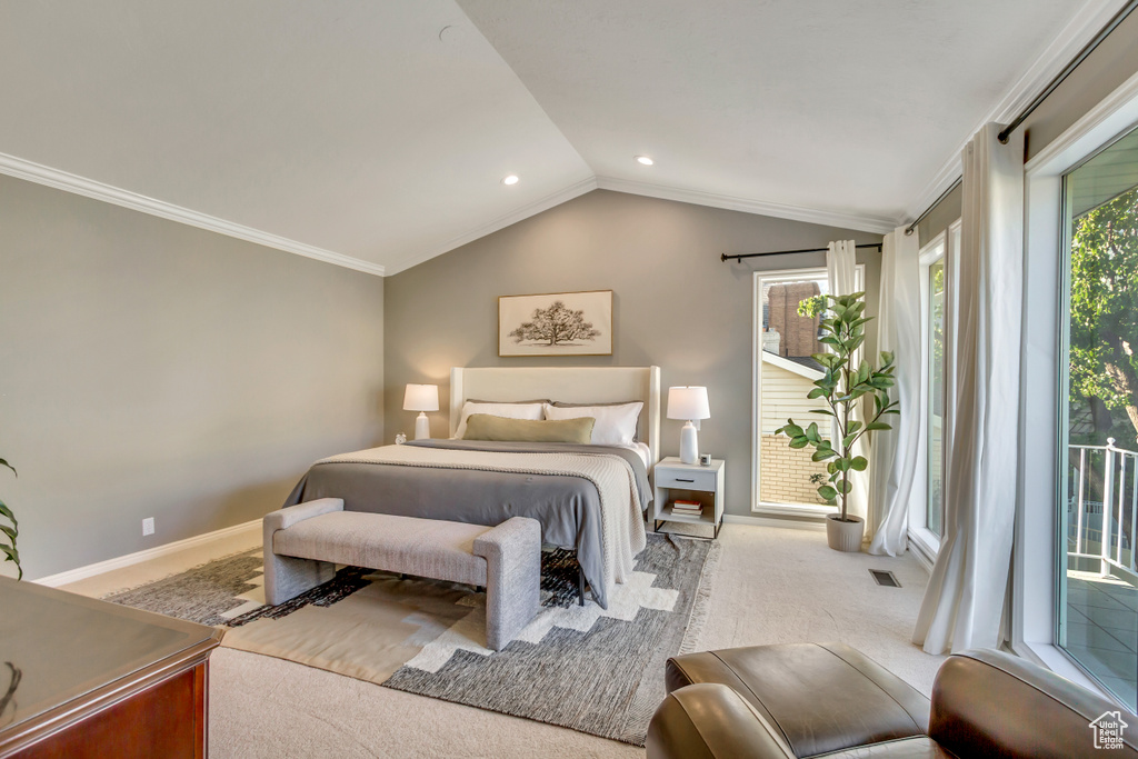 Bedroom with carpet flooring, lofted ceiling, multiple windows, crown molding, and access to outside