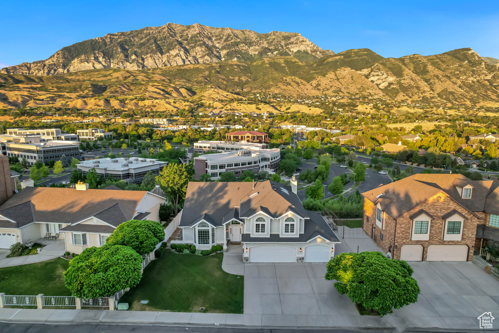 Aerial perspective of suburban area with a mountainous background