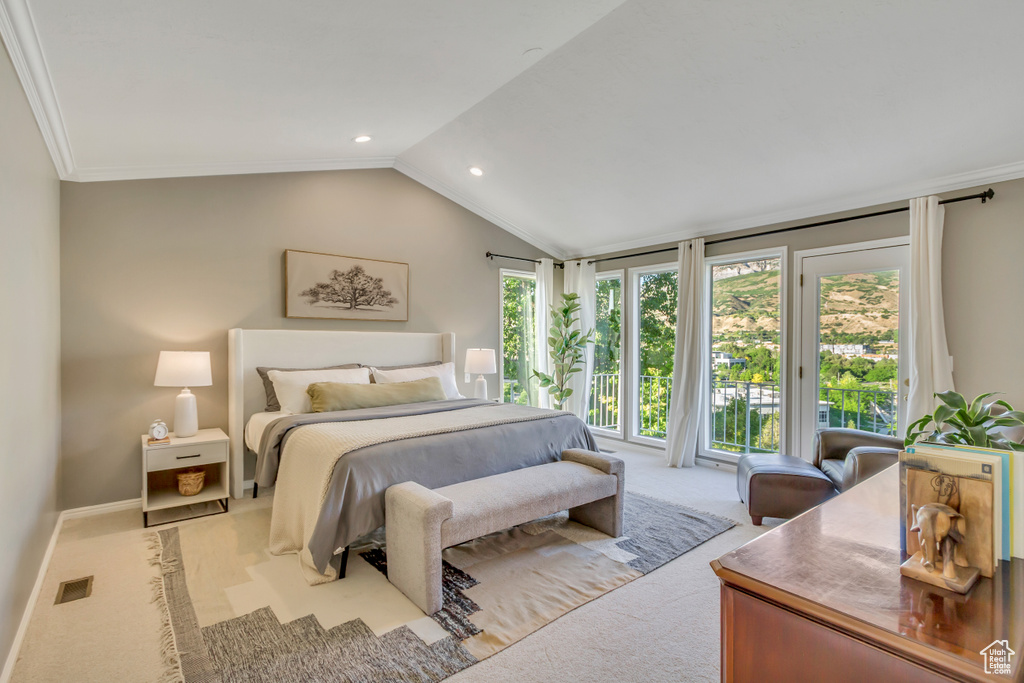 Carpeted bedroom with access to outside, vaulted ceiling, recessed lighting, and crown molding