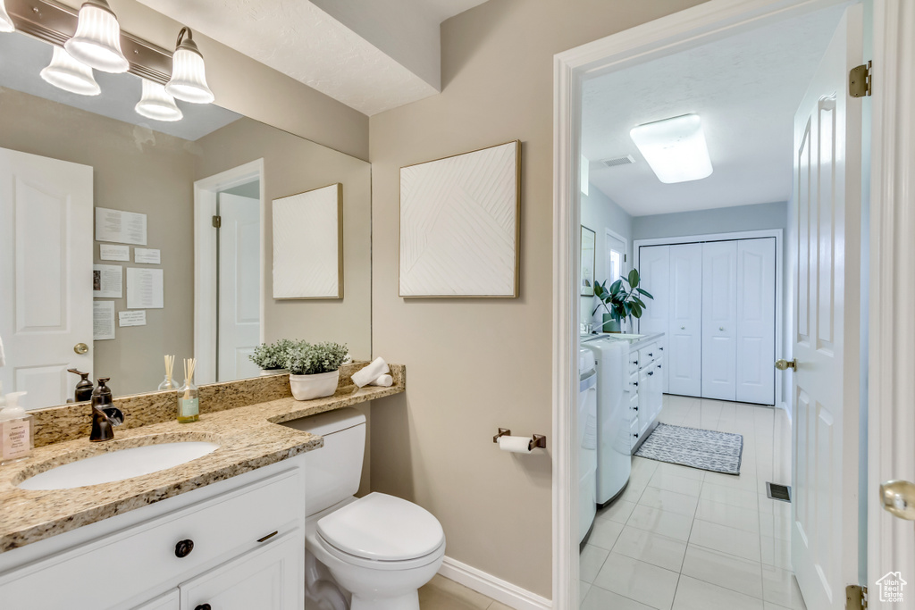 Bathroom featuring vanity and tile patterned flooring