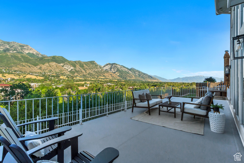 Patio / terrace with a mountain view and an outdoor living space