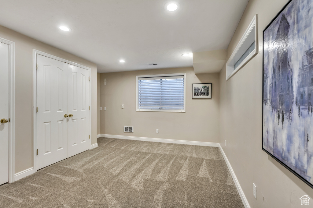 Unfurnished bedroom featuring carpet and recessed lighting
