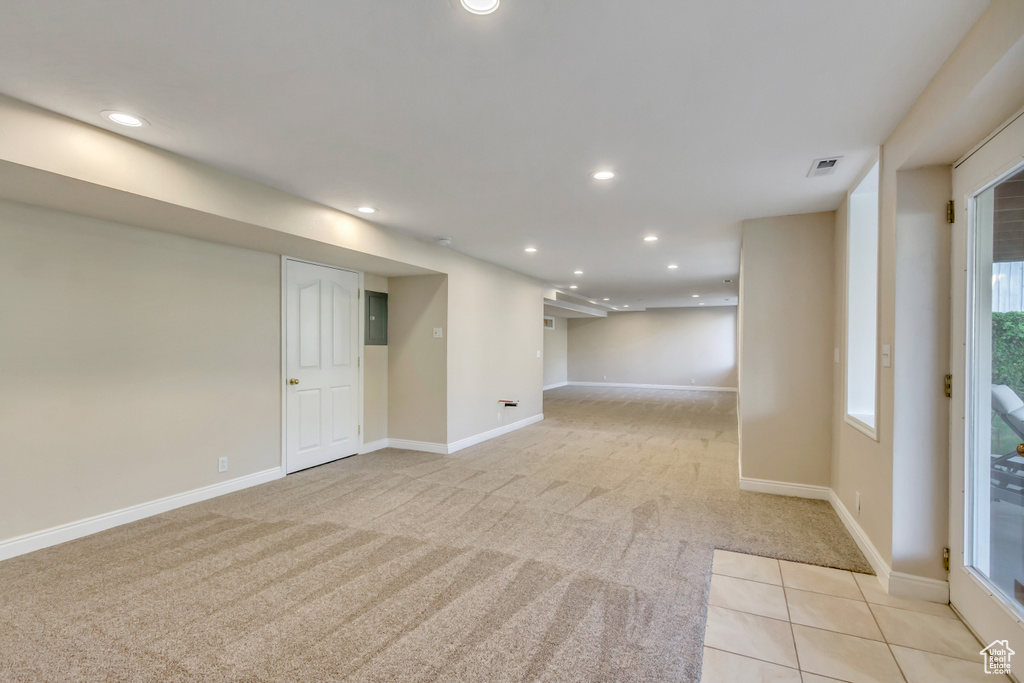 Empty room featuring recessed lighting and light carpet