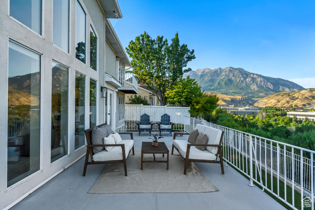Patio / terrace with a mountain view and an outdoor living space