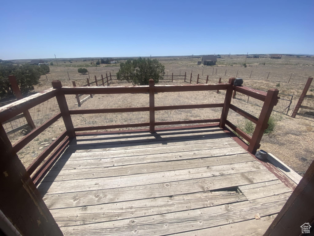 Wooden deck featuring a rural view