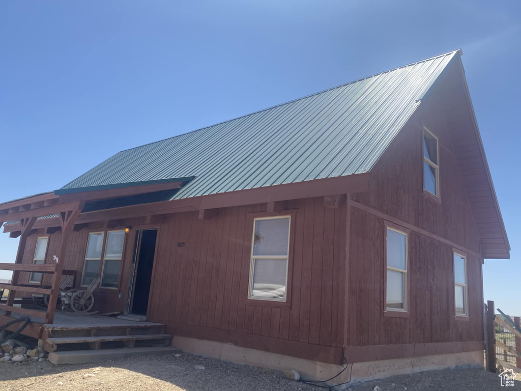 View of front of home featuring a metal roof