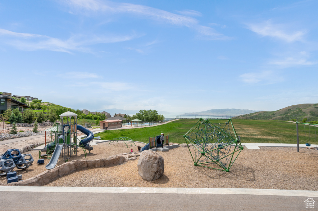 Communal playground featuring a mountain view