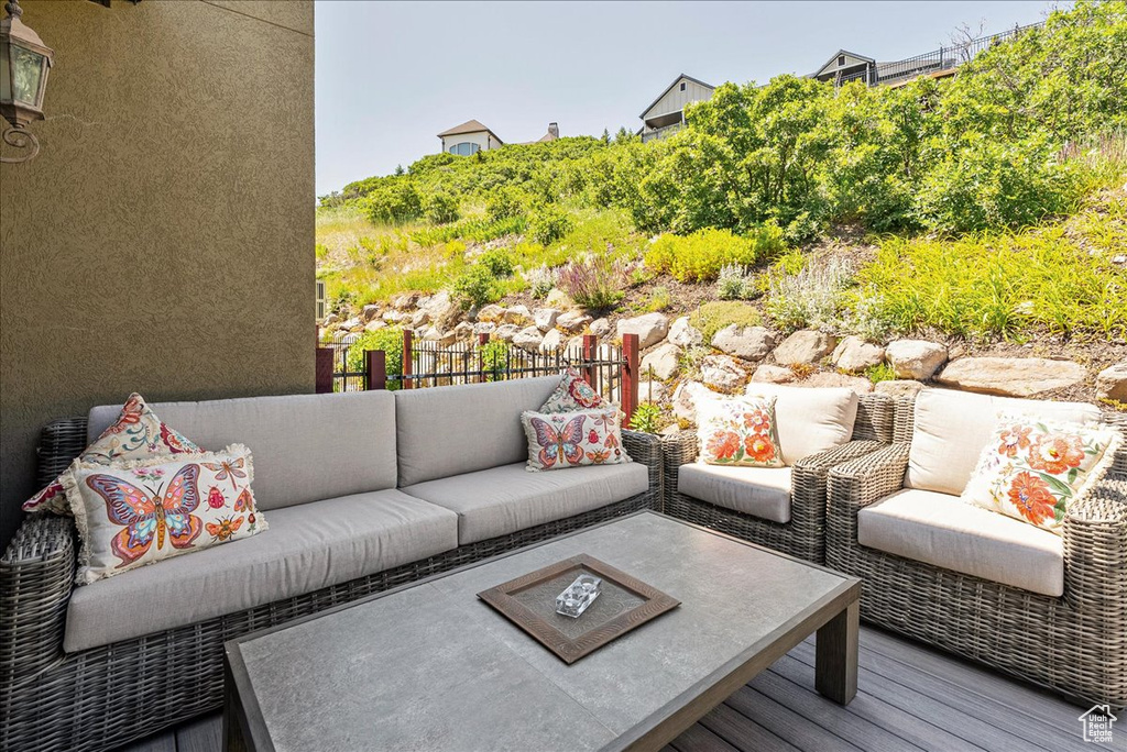 Wooden terrace featuring an outdoor living space