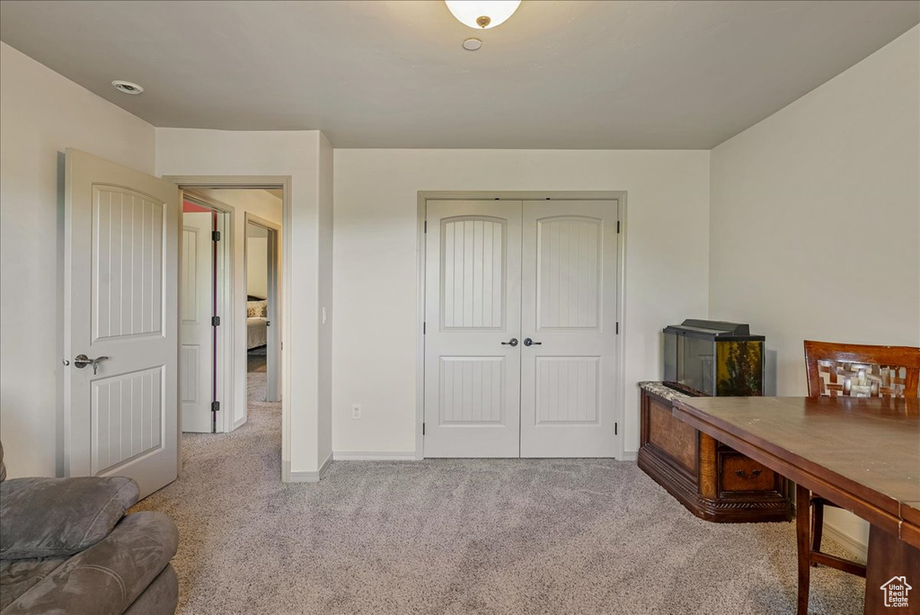 Home office featuring carpet