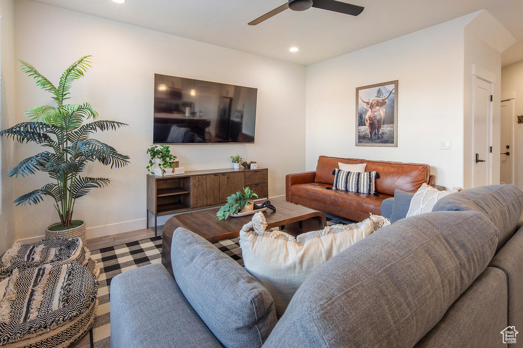 Living area with recessed lighting and a ceiling fan