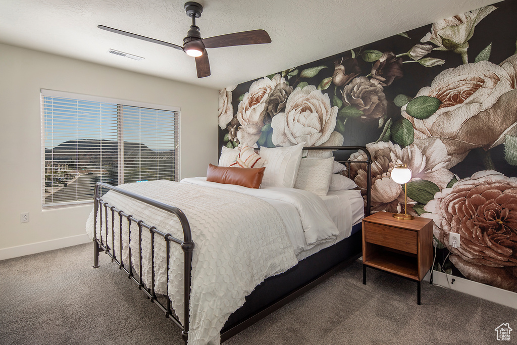 Bedroom with carpet flooring and a ceiling fan