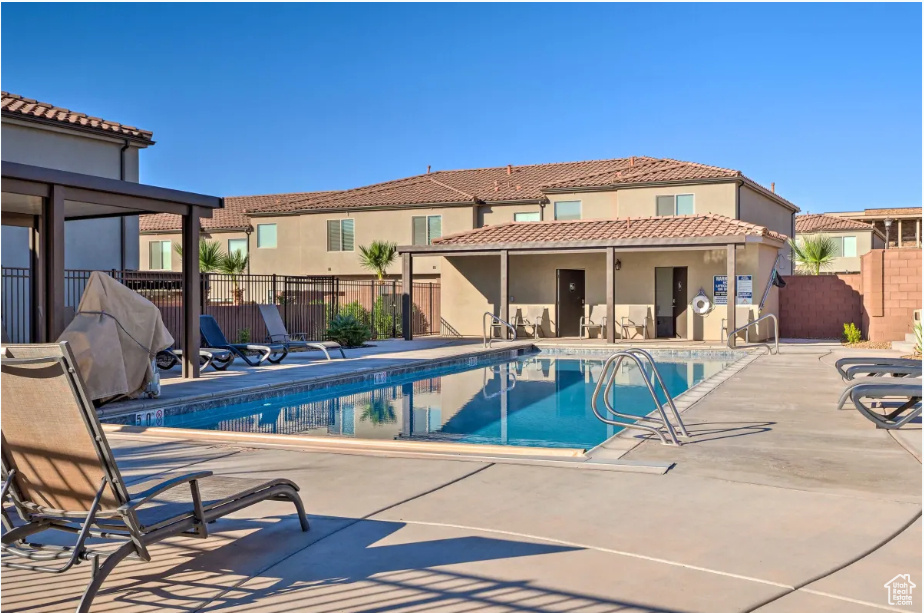 Community pool featuring a patio area