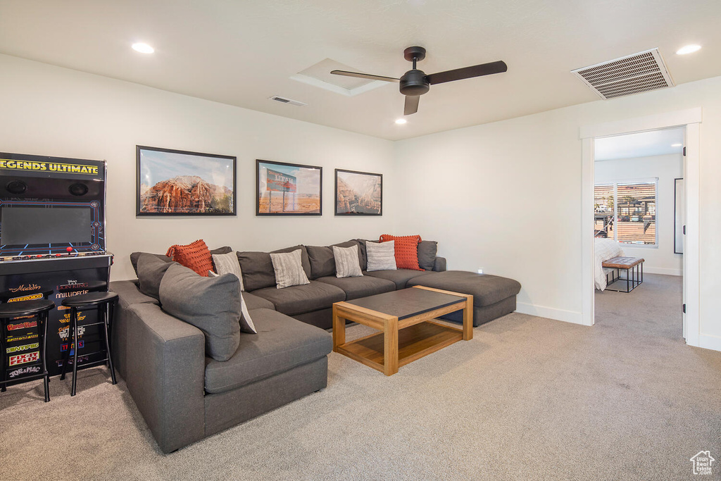 Living room featuring ceiling fan, carpet flooring, and recessed lighting