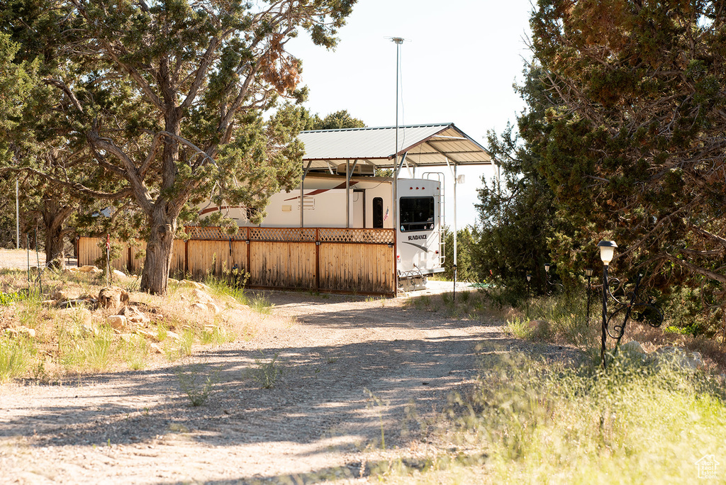 View of yard with a detached carport