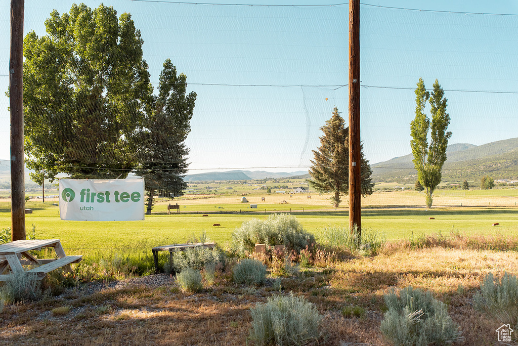 View of grassy yard featuring a mountain view